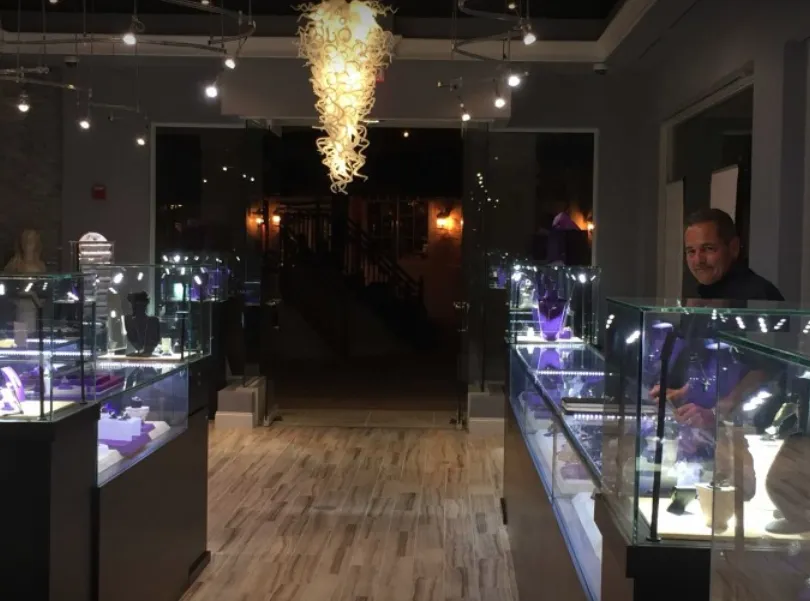Inside International Jewelers, among the glass display cases