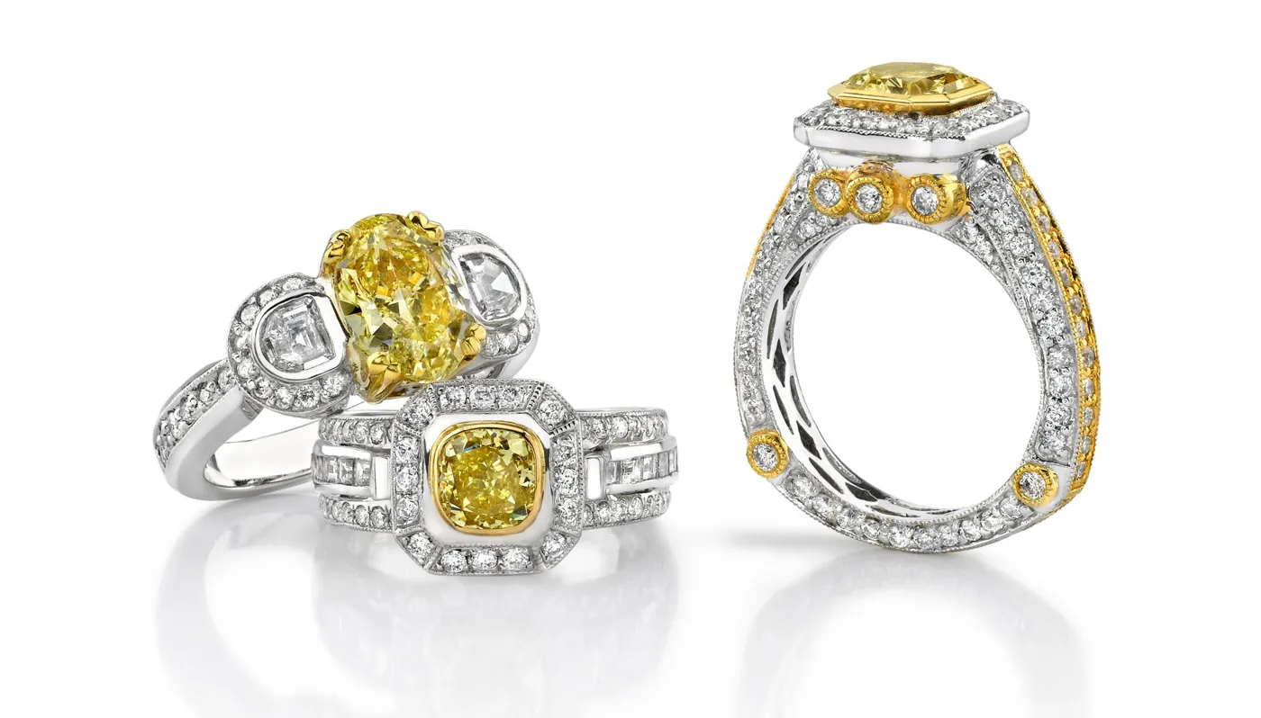 Fancy yellow diamond rings with diamond halos